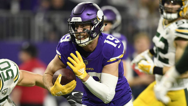 MINNEAPOLIS, MN - NOVEMBER 25: Adam Thielen #19 of the Minnesota Vikings runs with the ball for a 14 yard touchdown reception in the third quarter of the game against the Green Bay Packers at U.S. Bank Stadium on November 25, 2018 in Minneapolis, Minnesota.