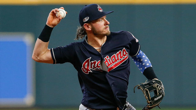 HOUSTON, TX - OCTOBER 06: Josh Donaldson #27 of the Cleveland Indians throws out a runner at first base in the second inning against the Houston Astros during Game Two of the American League Division Series at Minute Maid Park on October 6, 2018 in Houston, Texas.