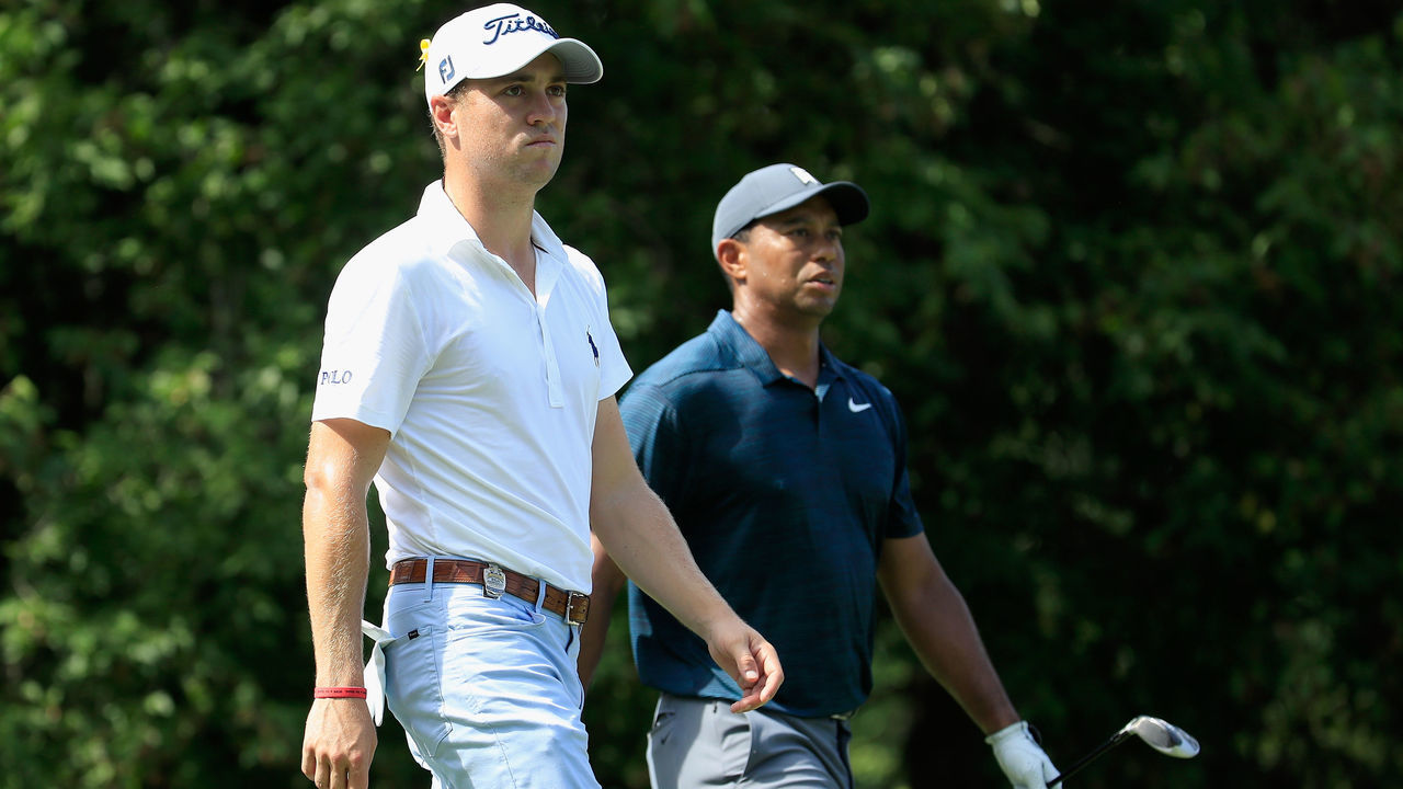 ST LOUIS, MO - AUGUST 09: Justin Thomas of the United States and Tiger Woods of the United States walk on the 18th hole during the first round of the 2018 PGA Championship at Bellerive Country Club on August 9, 2018 in St Louis, Missouri.