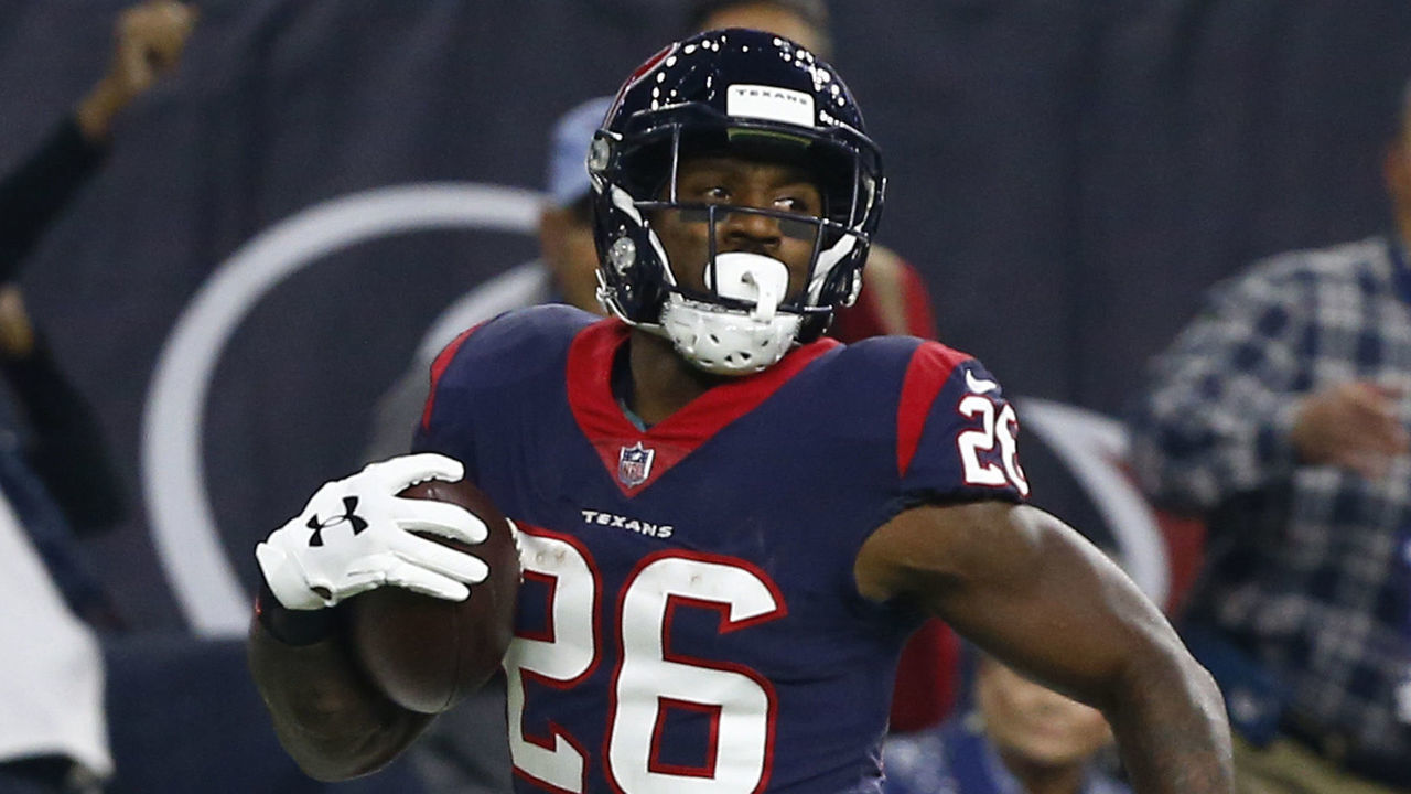 HOUSTON, TEXAS - NOVEMBER 26: Lamar Miller #26 of the Houston Texans looks back as he runs for a 97 yard touchdown during the second quarter against the Tennessee Titans at NRG Stadium on November 26, 2018 in Houston, Texas.