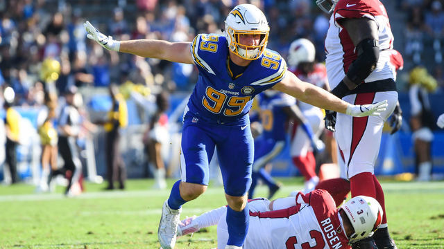 CARSON, CA - NOVEMBER 25: Defensive end Joey Bosa #99 of the Los Angeles Chargers celebrates his sack of quarterback Josh Rosen #3 of the Arizona Cardinals in the second quarter at StubHub Center on November 25, 2018 in Carson, California.