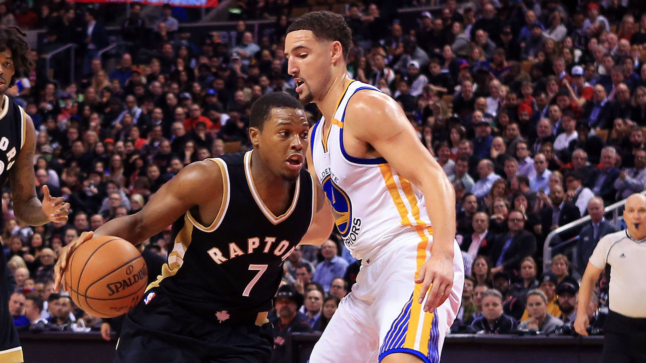 TORONTO, ON - NOVEMBER 16: Kyle Lowry #7 of the Toronto Raptors dribbles the ball as Klay Thompson #11 of the Golden State Warriors defends during the second half of an NBA game at Air Canada Centre on November 16, 2016 in Toronto, Canada.
