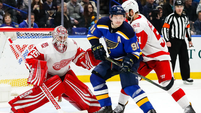 ST. LOUIS, MO - FEBRUARY 28: St. Louis Blues' Vladimir Tarasenko, center, looks for a tip in attempt in front of Detroit Red Wings goaltender Jimmy Howard (35), center, while under pressure by Detroit Red Wings' Frans Nielsen during the third period of an NHL hockey game. The St. Louis Blues defeated the Detroit Red Wings 2-1 on February 28, 2018, at Scottrade Center in St. Louis, MO.