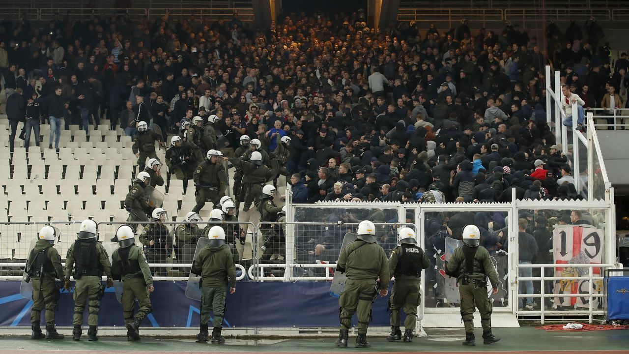 Greece police with Ajax fans during the UEFA Champions League group E match between AEK FC and Ajax Amsterdam at the OAKA Spyros Louis on November 27, 2018 in Athens, Greece