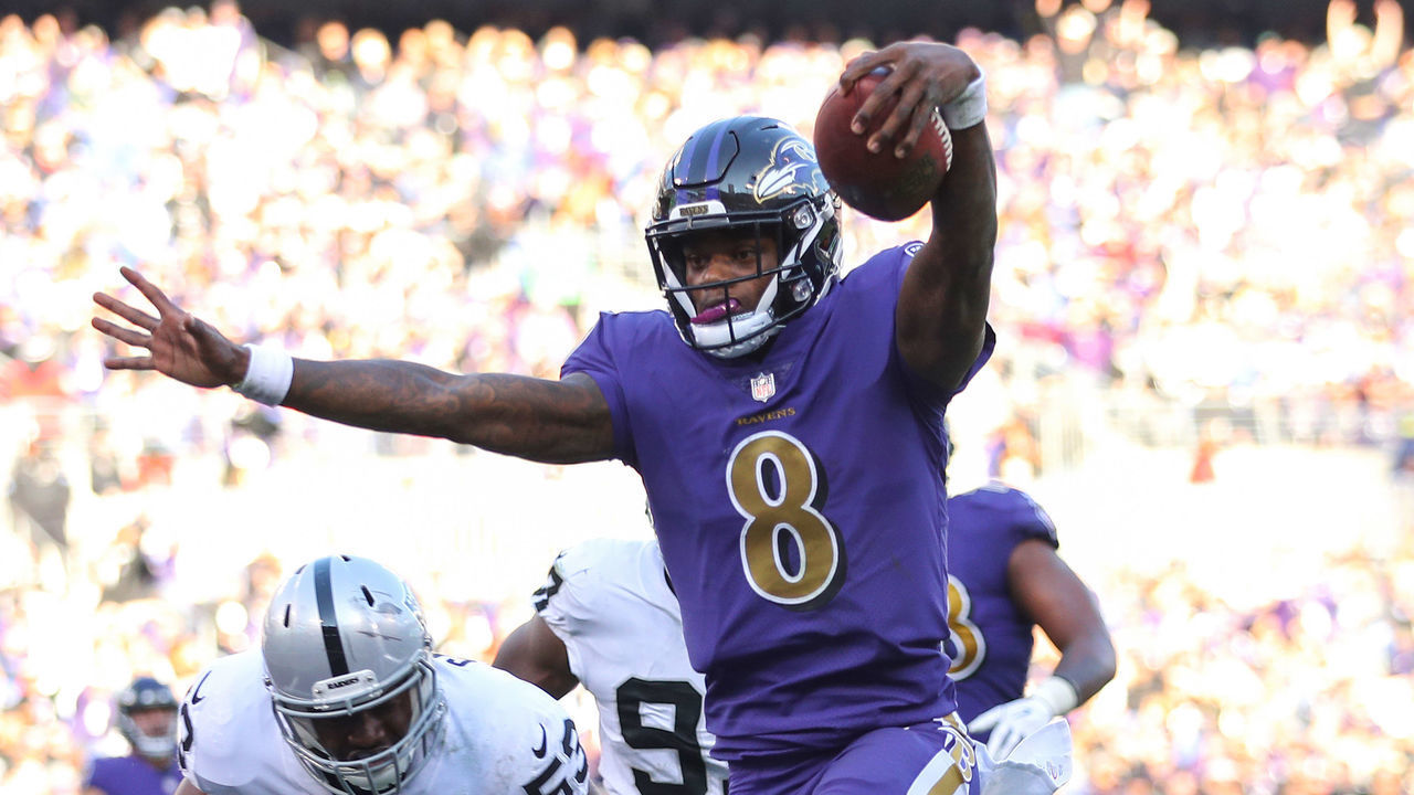 BALTIMORE, MARYLAND - NOVEMBER 25: Quarterback Lamar Jackson #8 of the Baltimore Ravens rushes for a touchdown during the third quarter against the Oakland Raiders at M&T Bank Stadium on November 25, 2018 in Baltimore, Maryland.