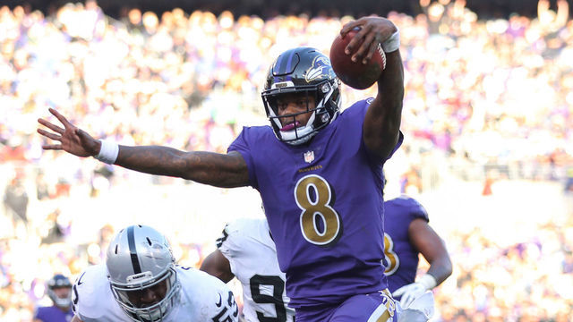 BALTIMORE, MARYLAND - NOVEMBER 25: Quarterback Lamar Jackson #8 of the Baltimore Ravens rushes for a touchdown during the third quarter against the Oakland Raiders at M&T Bank Stadium on November 25, 2018 in Baltimore, Maryland.