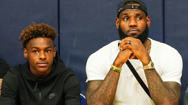 LAS VEGAS, NV - JULY 26: (L-R) LeBron James Jr., LeBron James Sr. and Bryce Maximus James watch Zaire Wade’s AAU game court side at the Fab 48 tournament at Bishop Gorman High School on July 26, 2018 in Las Vegas, Nevada.