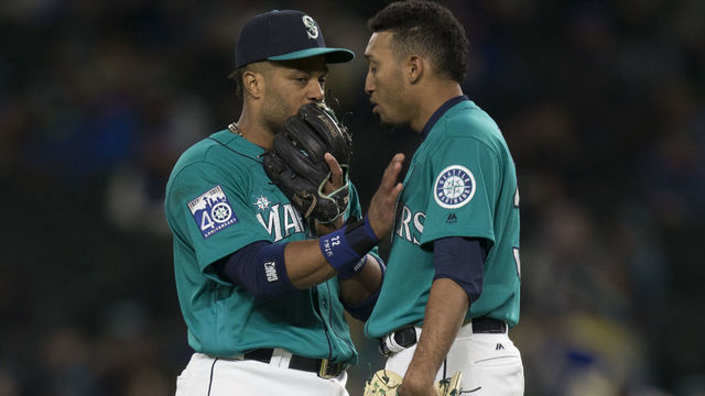 SEATTLE, WA - MAY 5: Relief pitcher Edwin Diaz #39, right, of the Seattle Mariners talks with second baseman Robinson Cano #22 of the Seattle Mariners before taking the mound during a game against the Texas Rangers at Safeco Field on May 5, 2017 in Seattle, Washington. The Rangers won the game 3-1 in 13 innings.