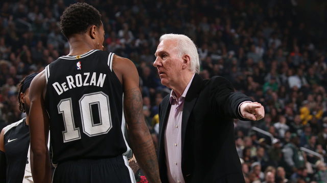 MILWAUKEE, WI - NOVEMBER 24: DeMar DeRozan #10 and Gregg Popovich of the San Antonio Spurs chat during the game on November 24, 2018 at the Fiserv Forum Center in Milwaukee, Wisconsin. Mandatory Copyright Notice: Copyright 2018 NBAE .