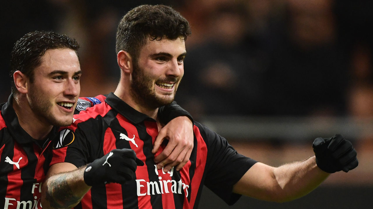 AC Milan's Italian forward Patrick Cutrone (R) celebrates with AC Milan's Italian defender Davide Calabria celebrates after opening the scoring during the UEFA Europa League group F football match AC Milan vs F91 Dudelange on November 29, 2018 at the San Siro stadium in Milan.