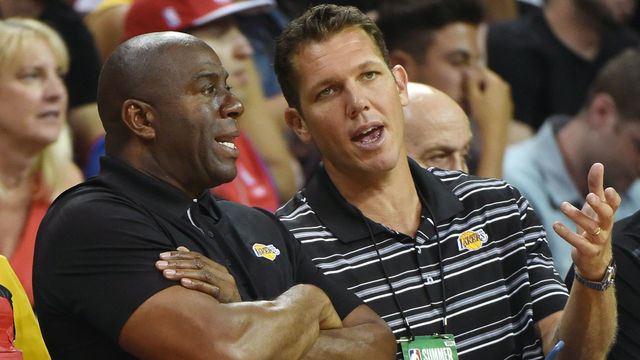 LAS VEGAS, NV - JULY 07: Los Angeles Lakers president of basketball operations Earvin 'Magic' Johnson (L) and head coach Luke Walton of the Lakers talk during a 2017 Summer League game between the Lakers and the Los Angeles Clippers at the Thomas & Mack Center on July 7, 2017 in Las Vegas, Nevada. The Clippers won 96-93 in overtime.