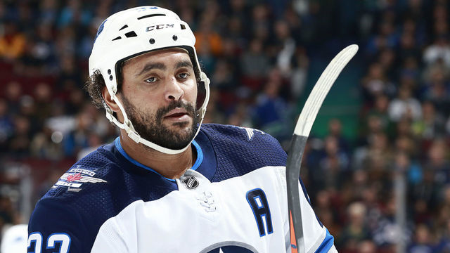 VANCOUVER, BC - NOVEMBER 19: Dustin Byfuglien #33 of the Winnipeg Jets looks on from the bench during their NHL game against the Vancouver Canucks at Rogers Arena November 19, 2018 in Vancouver, British Columbia, Canada. 'n