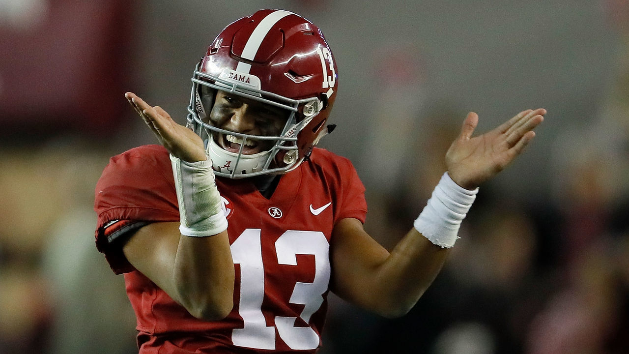 TUSCALOOSA, AL - NOVEMBER 24: Tua Tagovailoa #13 of the Alabama Crimson Tide reacts after passing for a touchdown to DeVonta Smith #6 against the Auburn Tigers at Bryant-Denny Stadium on November 24, 2018 in Tuscaloosa, Alabama.