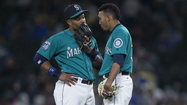 SEATTLE, WA - MAY 5: Relief pitcher Edwin Diaz #39, right, of the Seattle Mariners talks with second baseman Robinson Cano #22 of the Seattle Mariners before taking the mound during a game against the Texas Rangers at Safeco Field on May 5, 2017 in Seattle, Washington. The Rangers won the game 3-1 in 13 innings.
