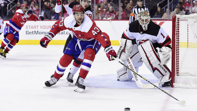 WASHINGTON, DC - NOVEMBER 30: Tom Wilson #43 of the Washington Capitals skates with the puck against Damon Severson #28 of the New Jersey Devils in the first period at Capital One Arena on November 30, 2018 in Washington, DC.