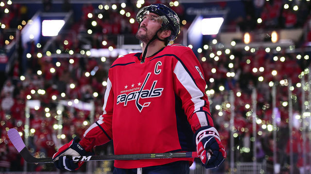 WASHINGTON, DC - NOVEMBER 23: Alex Ovechkin #8 of the Washington Capitals stands on the ice with his teammates and the Detroit Red Wings for a NHL-wide moment of silence for Hockey Fights Cancer before their game at Capital One Arena on November 23, 2018 in Washington, DC.
