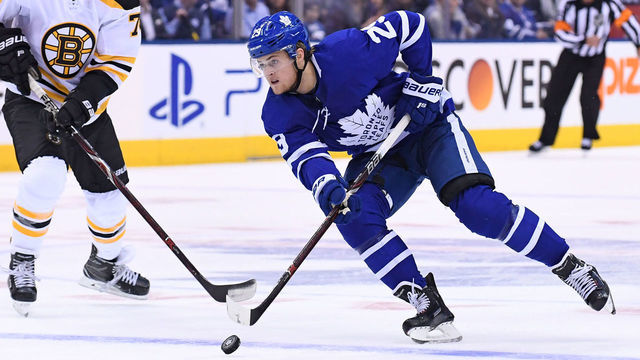 TORONTO, ON - APRIL 16: Toronto Maple Leafs Right Wing William Nylander (29) moves over the blue line in front of Boston Bruins forward Jake DeBrusk (74) during the Stanley Cup First Round Playoff game between the Boston Bruins and Toronto Maple Leafs on April 16, 2018 at Air Canada Centre in Toronto, ON.