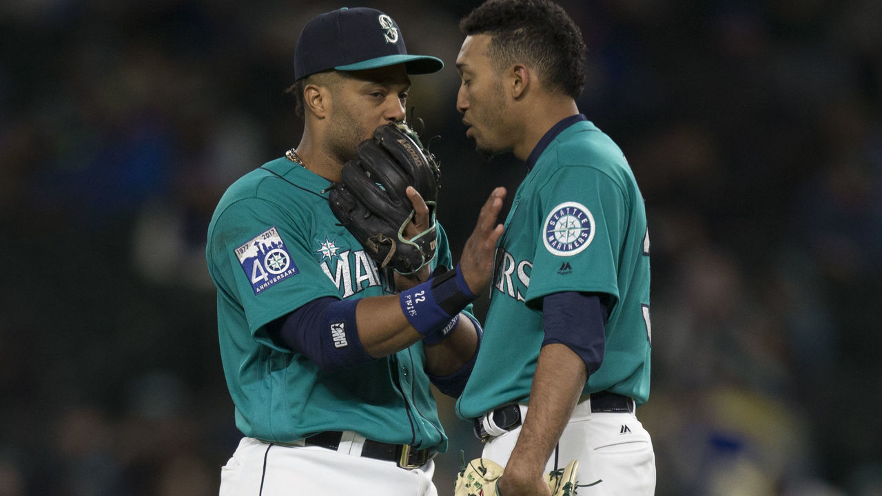 SEATTLE, WA - MAY 5: Relief pitcher Edwin Diaz #39, right, of the Seattle Mariners talks with second baseman Robinson Cano #22 of the Seattle Mariners before taking the mound during a game against the Texas Rangers at Safeco Field on May 5, 2017 in Seattle, Washington. The Rangers won the game 3-1 in 13 innings.