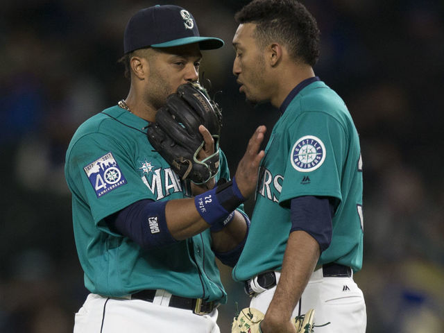 SEATTLE, WA - MAY 5: Relief pitcher Edwin Diaz #39, right, of the Seattle Mariners talks with second baseman Robinson Cano #22 of the Seattle Mariners before taking the mound during a game against the Texas Rangers at Safeco Field on May 5, 2017 in Seattle, Washington. The Rangers won the game 3-1 in 13 innings.