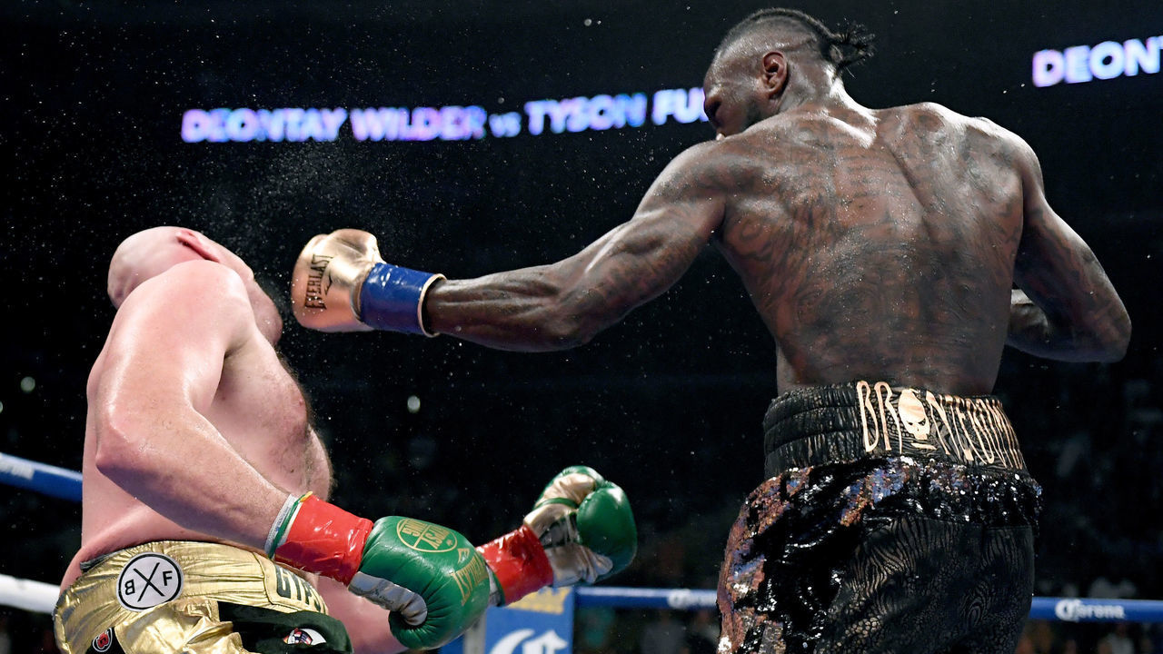 LOS ANGELES, CA - DECEMBER 01: Deontay Wilder knocks Tyson Fury down during the 12th round resulting in a draw during the WBC Heavyweight Champioinship at Staples Center on December 1, 2018 in Los Angeles, California.