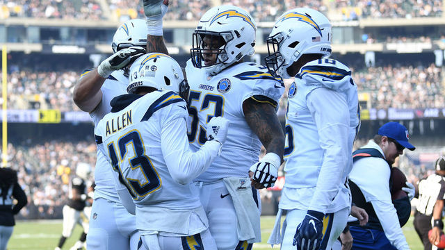 OAKLAND, CA - NOVEMBER 11: Keenan Allen #13 of the Los Angeles Chargers celebrates after an 11-yard touchdown against the Oakland Raiders during their NFL game at Oakland-Alameda County Coliseum on November 11, 2018 in Oakland, California.