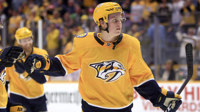 NASHVILLE, TN - DECEMBER 01: Nashville Predators right wing Eeli Tolvanen (11) congratulates teammates at the conclusion of the NHL game between the Nashville Predators and Chicago Blackhawks, held on December 1, 2018, at Bridgestone Arena in Nashville, Tennessee.