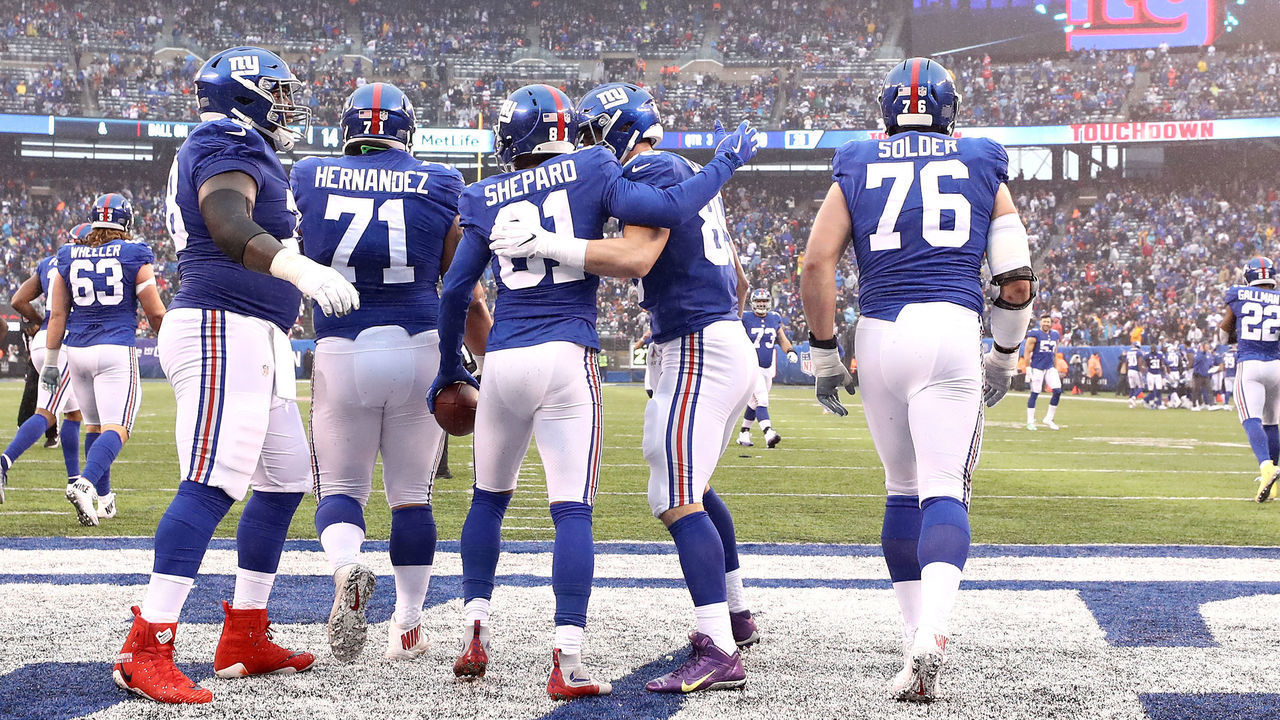 EAST RUTHERFORD, NEW JERSEY - DECEMBER 02: Russell Shepard #81 of the New York Giants is congratulated by his teammates after scoring a third quarter touchdown against the Chicago Bears at MetLife Stadium on December 02, 2018 in East Rutherford, New Jersey.