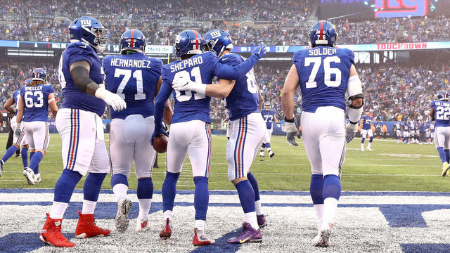 EAST RUTHERFORD, NEW JERSEY - DECEMBER 02: Russell Shepard #81 of the New York Giants is congratulated by his teammates after scoring a third quarter touchdown against the Chicago Bears at MetLife Stadium on December 02, 2018 in East Rutherford, New Jersey.