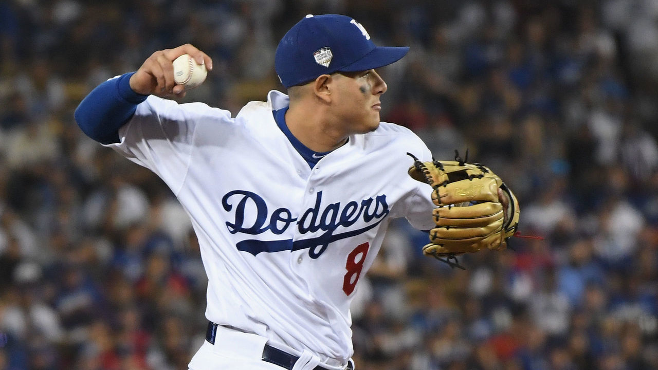 LOS ANGELES, CA - OCTOBER 26: Manny Machado #8 of the Los Angeles Dodgers fields the ball during the eleventh inning against the Boston Red Sox in Game Three of the 2018 World Series at Dodger Stadium on October 26, 2018 in Los Angeles, California.