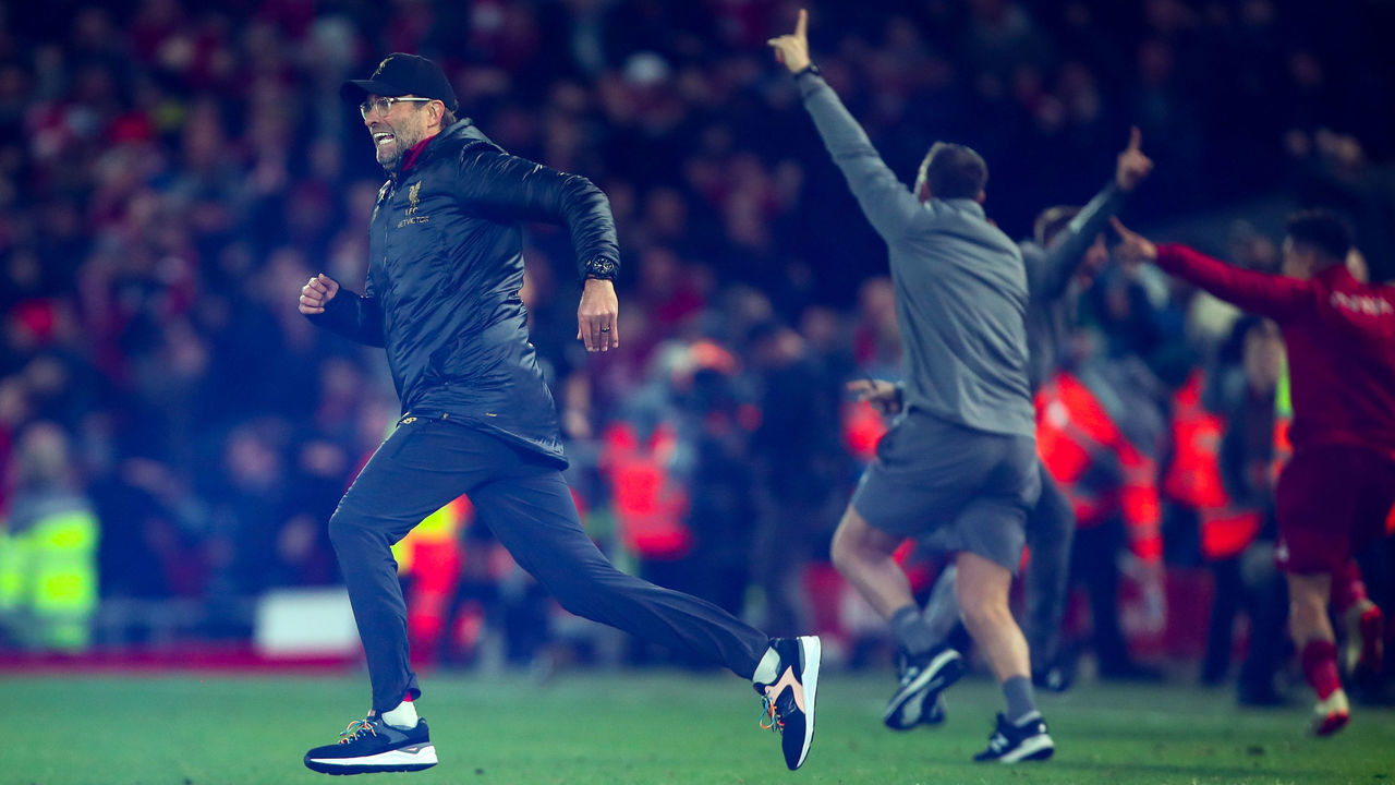 LIVERPOOL, ENGLAND - DECEMBER 02: Jurgen Klopp the manager / head coach of Liverpool celebrates and runs on the pitch as Divock Origi of Liverpool scores a goal to make it 1-0 during the Premier League match between Liverpool FC and Everton FC at Anfield on December 2, 2018 in Liverpool, United Kingdom.