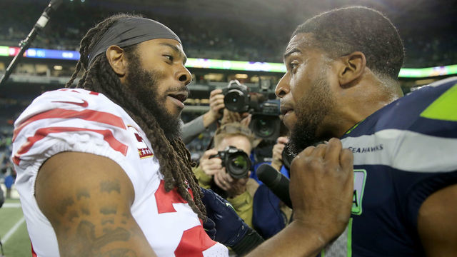 SEATTLE, WA - DECEMBER 02: Richard Sherman #25 of the San Francisco 49ers has a conversation with Doug Baldwin #89 of the Seattle Seahawks after the Seattle Seahawks defeated the San Francisco 49ers 43-16 during their game at CenturyLink Field on December 2, 2018 in Seattle, Washington.