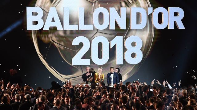 2018 FIFA Ballon d'Or awarded for best player of the year, Men's Ballon d'Or Real Madrid's Croatian midfielder Luka Modric (2ndL) is congratulated by former French footballer and host David Ginola (L) past Women's Ballon d'Or Olympique Lyonnais' Norwegian forward Ada Hegerberg (C) and Under-21 Ballon d'Or (Kopa trophy) Paris Saint-Germain's French forward Kylian Mbappe (2ndR) at the end of the 2018 FIFA Ballon d'Or award ceremony at the Grand Palais in Paris on December 3, 2018. - The winner of the 2018 Ballon d'Or will be revealed at a glittering ceremony in Paris on December 3 evening, with Croatia's Luka Modric and a host of French World Cup winners all hoping to finally end the 10-year duopoly of Cristiano Ronaldo and Lionel Messi.