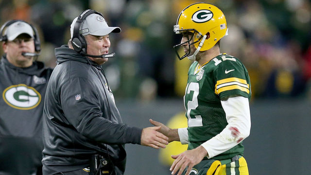 GREEN BAY, WI - OCTOBER 15: Head coach Mike McCarthy and Aaron Rodgers #12 of the Green Bay Packers celebrate after scoring a touchdown in the fourth quarter against the San Francisco 49ers at Lambeau Field on October 15, 2018 in Green Bay, Wisconsin.