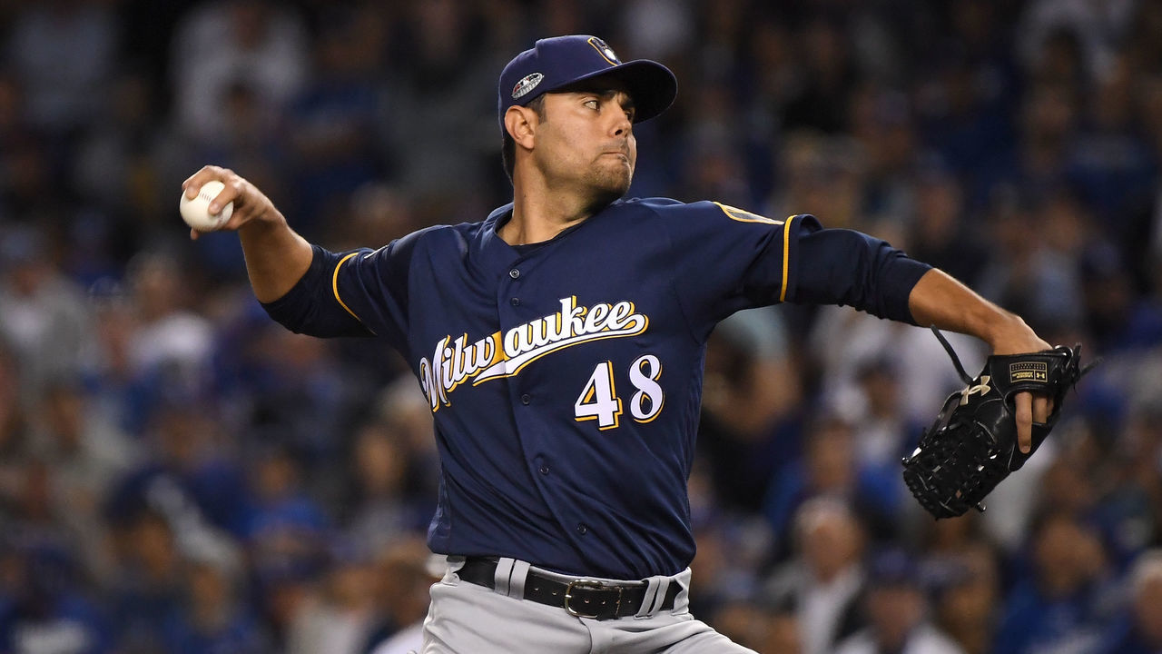 LOS ANGELES, CA - OCTOBER 16: Joakim Soria #48 of the Milwaukee Brewers delivers a pitch in the seventh inning against the Los Angeles Dodgers in Game Four of the National League Championship Series at Dodger Stadium on October 16, 2018 in Los Angeles, California.