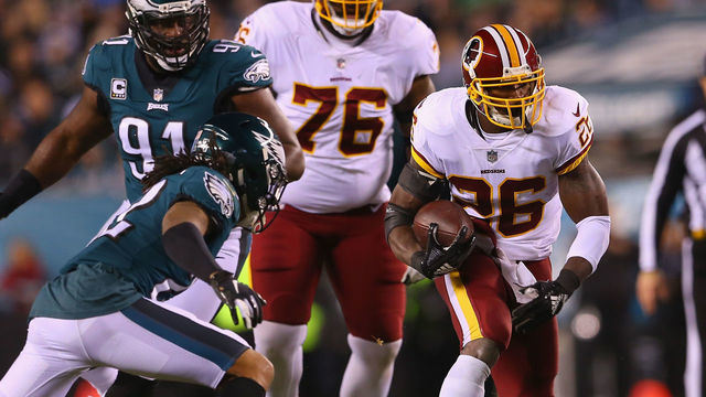 PHILADELPHIA, PA - DECEMBER 03: Running back Adrian Peterson #26 of the Washington Redskins runs the ball against cornerback Sidney Jones #22 of the Philadelphia Eagles in the first quarter at Lincoln Financial Field on December 3, 2018 in Philadelphia, Pennsylvania.