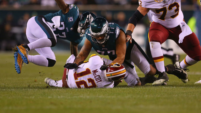 PHILADELPHIA, PA - DECEMBER 03: Quarterback Colt McCoy #12 of the Washington Redskins is sacked by safety Malcolm Jenkins #27 and defensive end Michael Bennett #77 of the Philadelphia Eagles in the first quarter at Lincoln Financial Field on December 3, 2018 in Philadelphia, Pennsylvania.