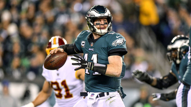 PHILADELPHIA, PA - DECEMBER 03: Philadelphia Eagles quarterback Carson Wentz (11) looks to pass during the NFL game between the Washington Redskins and the Philadelphia Eagles on December 03, 2018 at Lincoln Financial Field in Philadelphia, PA.