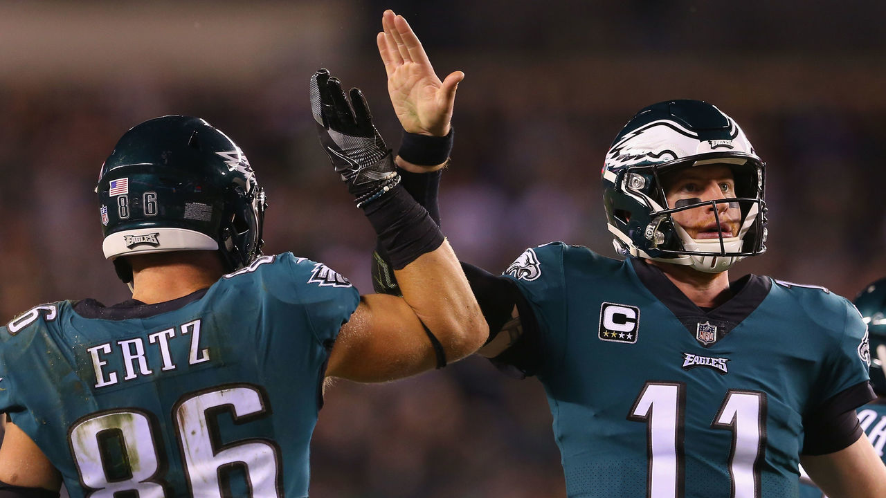 PHILADELPHIA, PA - DECEMBER 03: Tight end Zach Ertz #86 high-fives teammate quarterback Carson Wentz #11 of the Philadelphia Eagles after a catch for a first down against the Washington Redskins during the second quarter at Lincoln Financial Field on December 3, 2018 in Philadelphia, Pennsylvania.