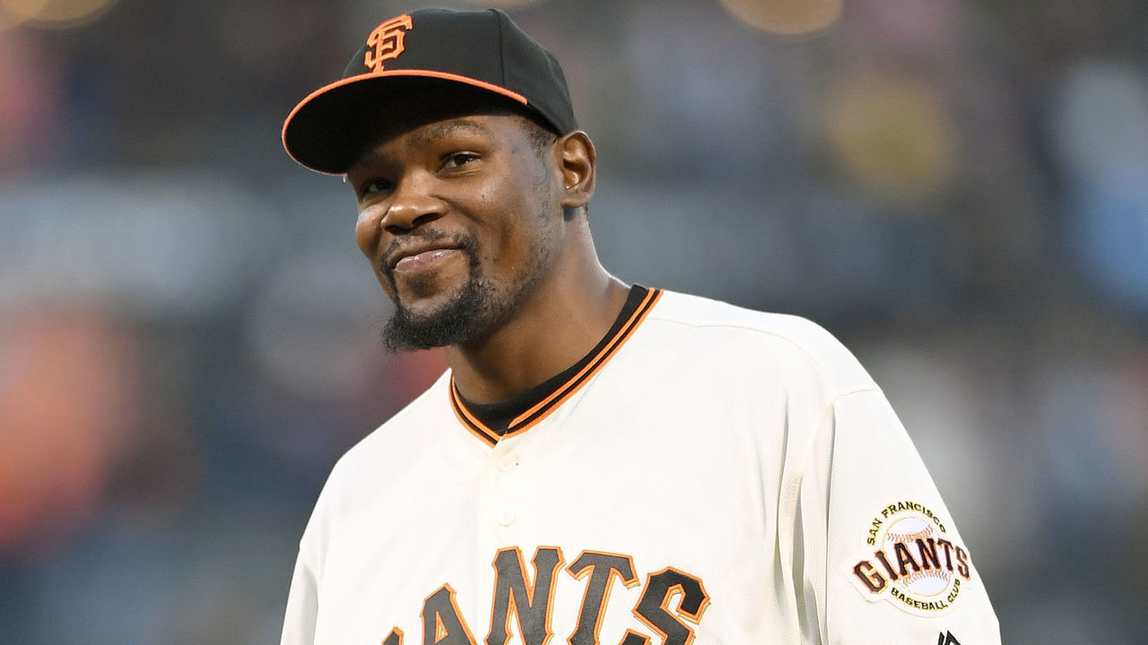 SAN FRANCISCO, CA - SEPTEMBER 16: Kevin Durant #35 of the Golden State Warriors walks off the mound smiling after throwing out the ceremonial first pitch prior to the start of the game between the St. Louis Cardinals and San Francisco Giants at AT&T Park on September 16, 2016 in San Francisco, California.
