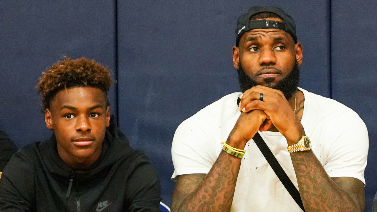 LAS VEGAS, NV - JULY 26: (L-R) LeBron James Jr., LeBron James Sr. and Bryce Maximus James watch Zaire Wade’s AAU game court side at the Fab 48 tournament at Bishop Gorman High School on July 26, 2018 in Las Vegas, Nevada.
