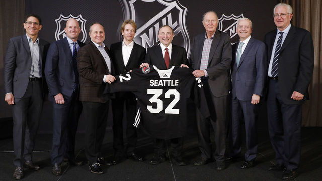 SEA ISLAND, GA - DECEMBER 04: (L to R) Adrian Hanauer, NHL Seattle franchise Vice-Chairman David Wright, Jay Deutsch, Jerry Bruckheimer, NHL Commissioner Gary Bettman, NHL Seattle franchise majority owner David Bonderman, Len Potter, and NHL Seattle franchise President and CEO Tod Leiweke pose for a photo during the NHL Board of Governors Meeting on December 4, 2018 in Sea Island, Georgia. The NHL Board of Governors approved expanding to Seattle, making the franchise the 32nd team in the league.