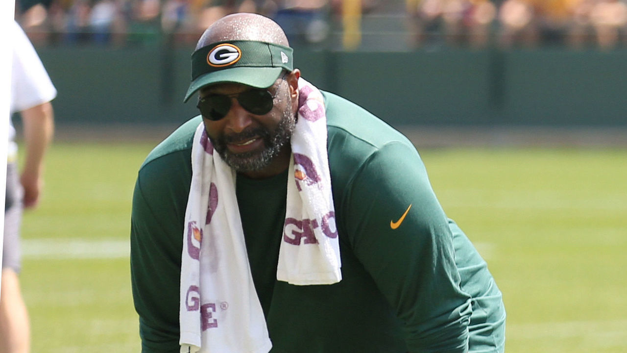 ASHWAUBENON, WI - JULY 30: Green Bay Packers linebacker Marcus Porter (59) runs in coverage while linebackers coach Winston Moss looks on during Green Bay Packers training camp at Ray Ntschke Field on July 30, 2018 in Ashwaubenon, WI.