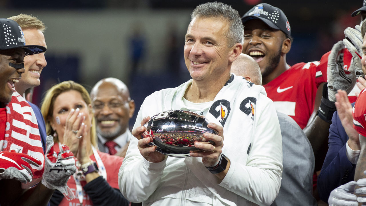 INDIANAPOLIS, IN - DECEMBER 01: Ohio State Buckeyes head coach Urban Meyer holds the Big Ten Championship trophy after the Big Ten Championship Game between the Ohio State Buckeyes and the Northwestern Wildcats on December 1, 2018 in Indianapolis, IN at Lucas Oil Stadium. Ohio State Buckeyes won 45-24.