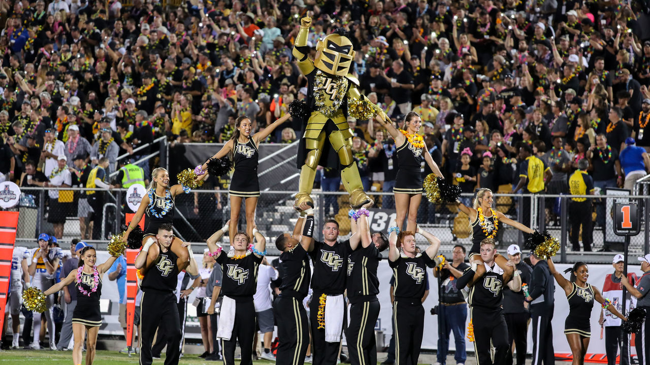 ORLANDO, FL - DECEMBER 01: The UCF cheerleaders and mascot perform during the AAC Championship football game between the visiting Memphis Tigers and the UCF Knights on December 1, 2018, at Spectrum Stadium in Orlando, FL.