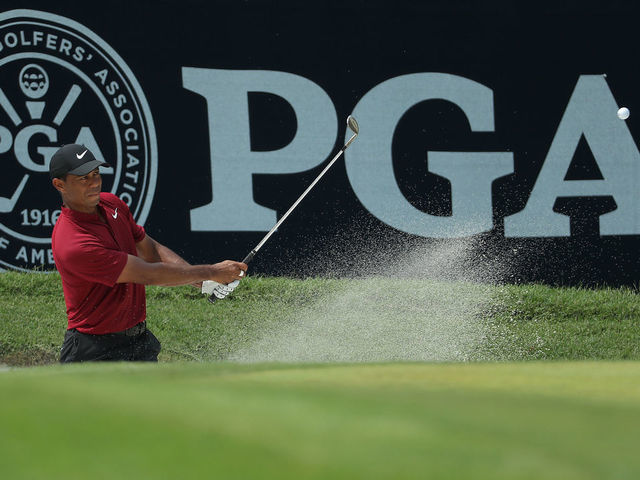 ST LOUIS, MISSOURI - AUGUST 12: Tiger Woods of the United States plays from a greenside bunker on the sixth hole during the final round of the 2018 PGA Championship at Bellerive Country Club on August 12, 2018 in St Louis, Missouri.