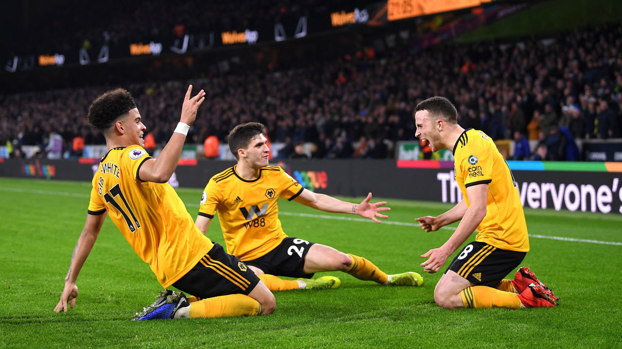 WOLVERHAMPTON, ENGLAND - DECEMBER 05: Diogo Jota of Wolverhampton Wanderers celebrates with teammates after scoring his team's second goal during the Premier League match between Wolverhampton Wanderers and Chelsea FC at Molineux on December 5, 2018 in Wolverhampton, United Kingdom.
