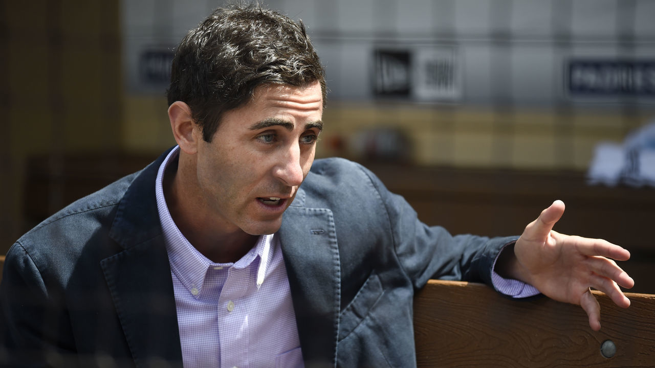 SAN DIEGO, CA - APRIL 7: San Diego Padres general manager A.J. Preller talks with reporters on opening day before a baseball game between the San Francisco Giants and the San Diego Padres at PETCO Park on April 7, 2017 in San Diego, California.