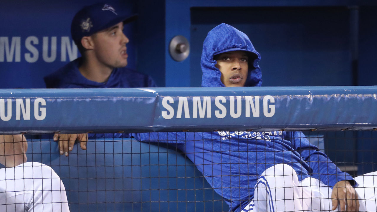 TORONTO, ON - APRIL 17: Marcus Stroman #6 (R) of the Toronto Blue Jays looks on from the top step of the dugout as Aaron Sanchez #41 sits behind him during MLB game action against the Kansas City Royals at Rogers Centre on April 17, 2018 in Toronto, Canada. *** Local Caption *** Marcus Stroman;Aaron Sanchez