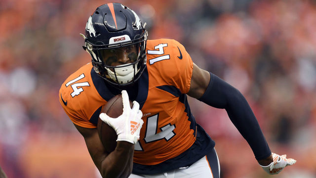 DENVER, CO - NOVEMBER 4, 2018: Wide receiver Courtland Sutton #14 of the Denver Broncos gains yards with pressure from defensive back Natrell Jamerson #31 of the Houston Texans during the first quarter on Sunday, November 4 at Broncos Stadium at Mile High. The Denver Broncos hosted the Houston Texans.