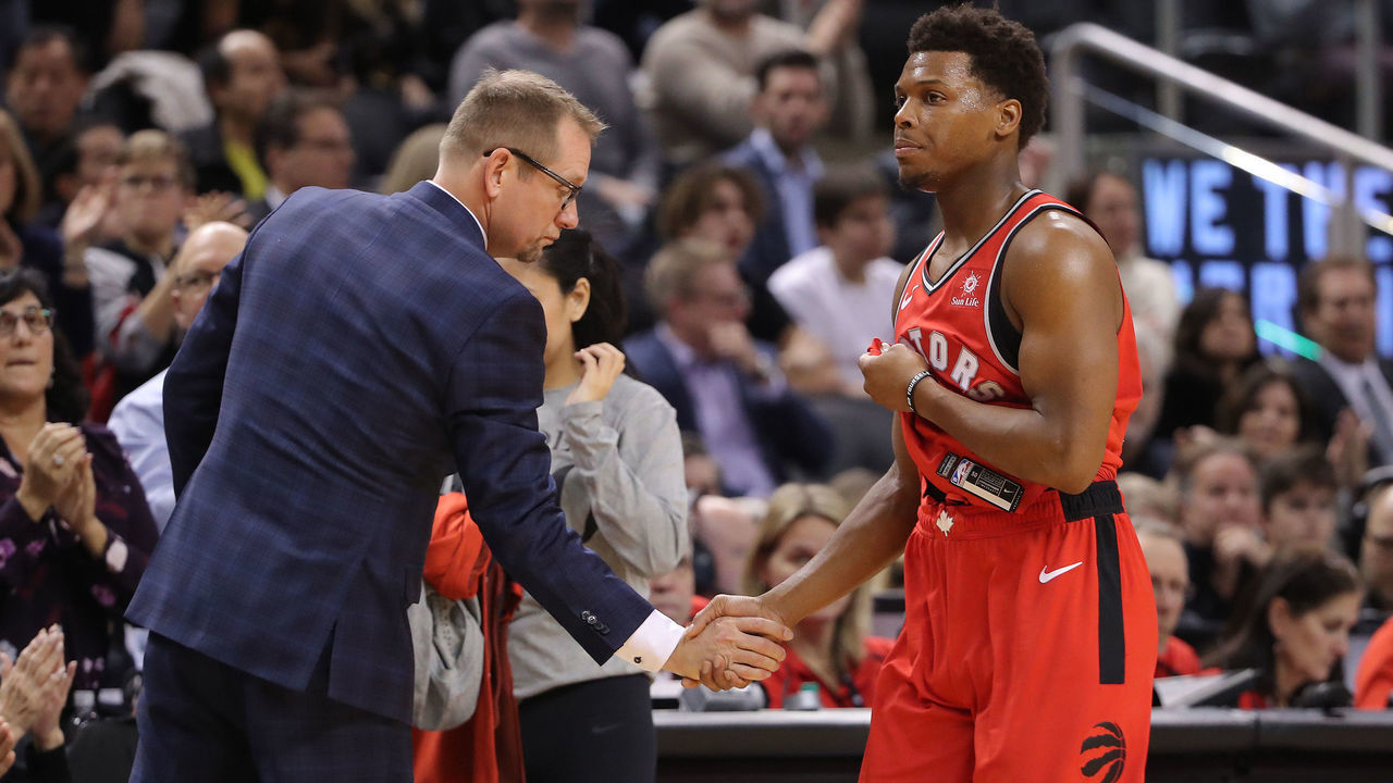 TORONTO, ON - DECEMBER 05: Head coach Nick Nurse of the Toronto Raptors congratulates Kyle Lowry #7 as Lowry comes out of the game in the fourth quarter against the Philadelphia 76ers at Scotiabank Arena on December 5, 2018 in Toronto, Canada.